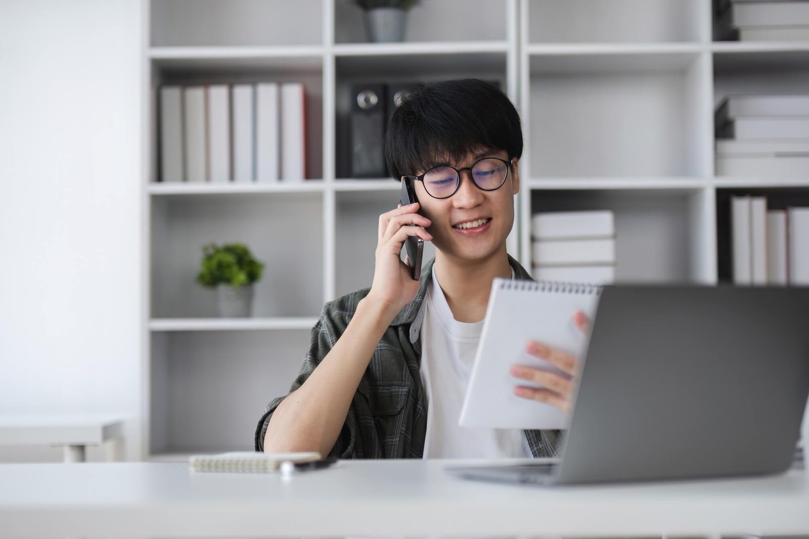 Professional reviewing documents on a call